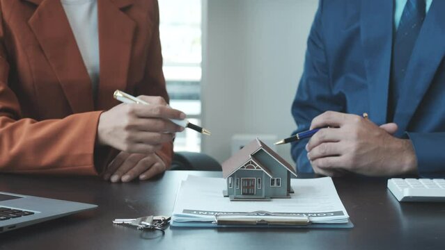 Real estate agent and realtor general liability insurance businessman professional consultant with house toy model