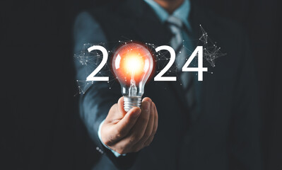 2024 creative concept, business man holding light bulb 2024 numbers, 2024 number for creative thinking idea for start new business concept.