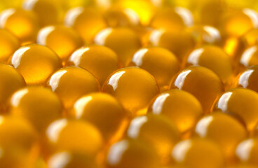 blurred background clear capsules filled with a dose of fish oil with omega-3 vitamin, very useful medicine, strong immunity, useful every day, lots of vitamin capsules,natural product,Fish Oil