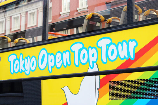 TOKYO, JAPAN - October 3, 2021: detail of an open top double-decker operated by Hato Bus parked by Tokyo Station.