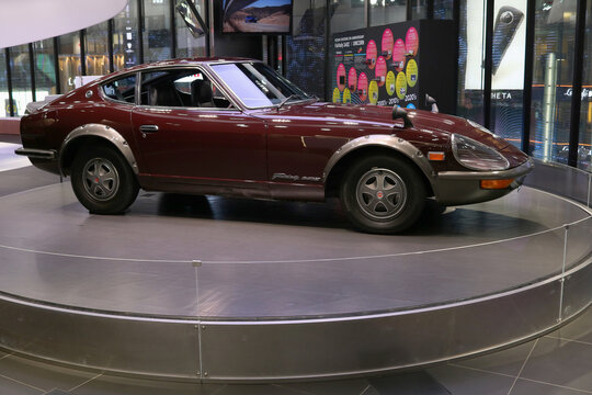 TOKYO, JAPAN - November 24, 2021: A Nissan Fairlady 240z displayed on a turntable in a showroom in Ginza. It's part of a Nissan Crossing 5th Anniversary Fairlady 240z X Unicorn event.