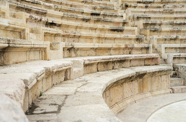 Ancient antique amphitheater stairs and seats close up
