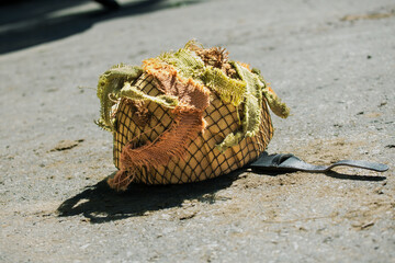An Mk II British Parachute helmet from the Second World War lies on the ground.