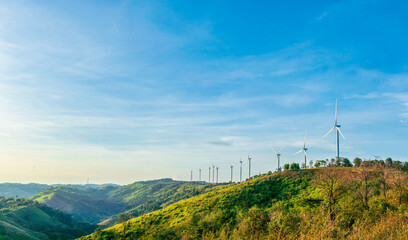 Clean and renewable energy to reduce carbon emissions concept, several wind turbines generating...
