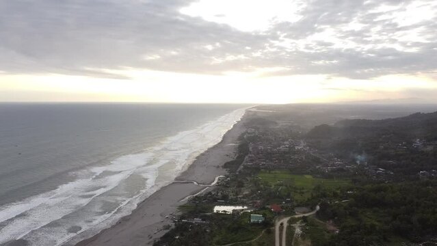 The beauty of the stunning beach scenery with drone footage from Paralayang Hill in Parangtritis