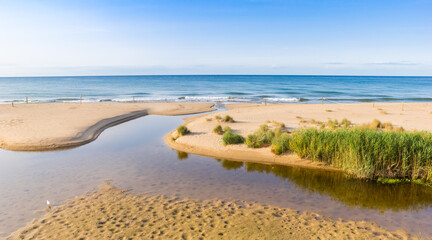 Tranquil mediterranean sea and beach in Comarruga, Spain