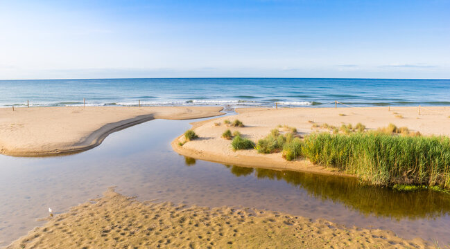 Tranquil mediterranean sea and beach in Comarruga, Spain