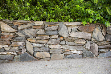 The rugged beauty of the stone wall texture reveals strength and history. A symbol of resilience, authenticity, and the passage of time etched in every crevice