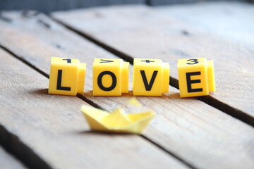 love text. Greeting card with text on wooden background