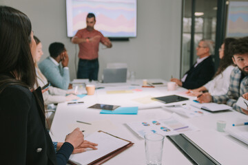 Fototapeta premium Close up of business woman listeting to the presentation