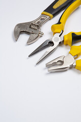 Set of tools for repair in a case on a white background. Assorted work or construction tools. Wrenches, Pliers, screwdriver. Top view
