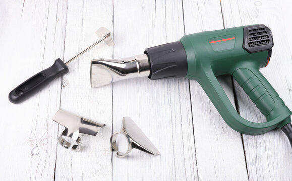 Construction hair dryer with different nozzles for work.