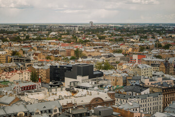Fototapeta na wymiar Aerial view of a residential district in an ancient city, filled with bustling crowds and awe-inspiring architecture of Riga