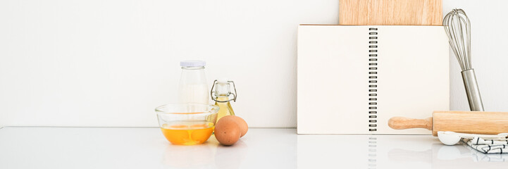 Blank notepad on a white background. Culinary cooking baking concept, place for a recipe. Front view. Banner