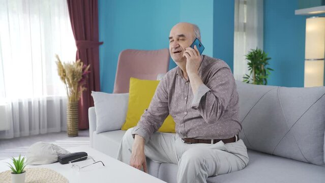 Old man talking longingly on the phone.