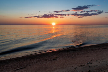 Fototapeta na wymiar Sunset on the lake. Pskov region. Russia