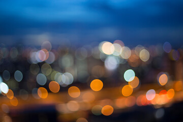 Bokeh from incandescent lights in the city at dusk
