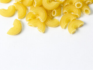 fresh dry macaroni elbow on white, side view