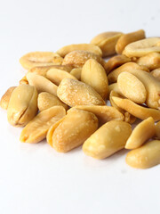 close up of peanuts isolated on white