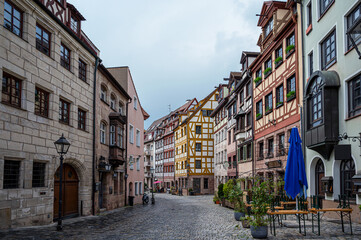 Fototapeta na wymiar Street with beautiful colorful half timbered houses In Nuremberg, Germany