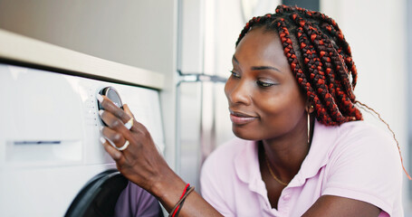 Person Hand Pressing Button Of Washing Machine