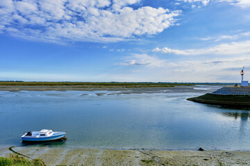 Fototapeta na wymiar channel of entrance to the port at low tide of Saint Valery sur Somme in the Hauts-de-France departement, France