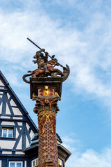 Fototapeta na wymiar Statue of Saint George and the dragon in Rothenburg ob der Tauber, Germany, Europe