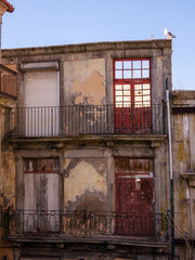 old decrepit and abandoned building in the historic center of porto, portugal