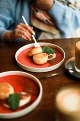 Girl eats dessert in a restaurant. The girl eats cheesecakes.