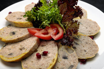 stuffed chicken with lettuce leaves and tomatoes