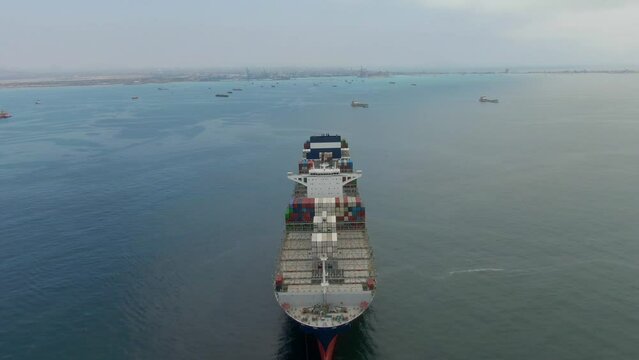 Callao, Lima, Peru -12.04.2022 Aerial view of ultra large container ship CMA CGM J.Adams in discharged condition at anchor near port Callao, Lima, Peru awaiting for enter to port with another ships