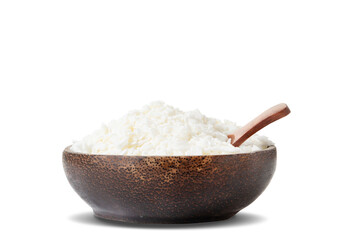 Organic white soy wax flakes for candles in coconut bowl isolated on white background