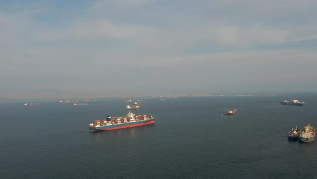 Callao, Lima, Peru -12.04.2022 Aerial view of Callao anchorage with large container ship and another vessels waiting for enter to the port