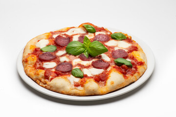 pizza with salami and tomatoes and mozzarella on white background - 604399810