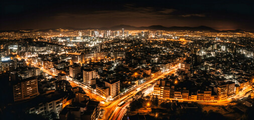 Obraz premium night view of a city with many lights and a city of buildings