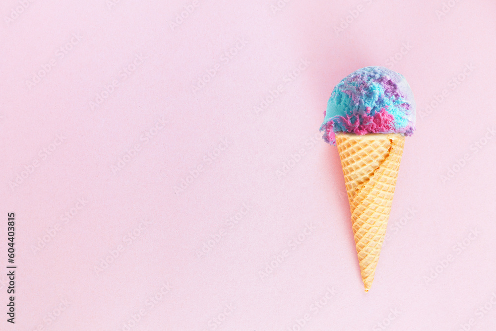 Aufkleber single ice cream cone with pastel cotton candy ice cream over a textured pink background. top view w