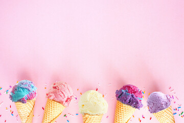 Ice cream bottom border over a pink background. Soft, pastel colors. Copy space.