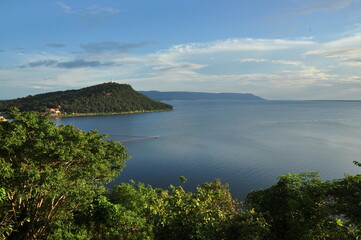 Overview of Ubonrat Dam, famous Dam in northeast of Thailand, beautiful coastline with hill, trees and blue sky