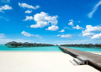 Beautiful beach with white sand.  ocean, blue sky with clouds.  Sunny day. Maldives tropical landscape