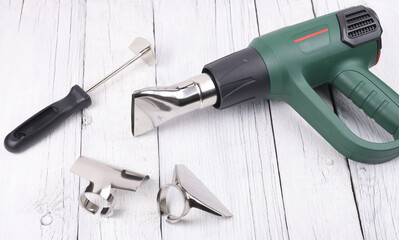 Construction hair dryer with different nozzles for work.