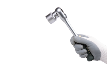 A hand in a protective glove holds a ratchet wrench (socket) on a white background.
