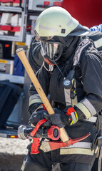 Firefighter with gas mask and axe