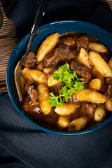 Beef stew in gravy.
