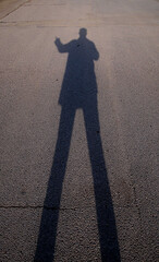 silhouette of a person walking on the street