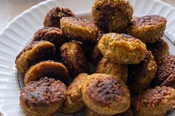 falafel and hummus on a white plate