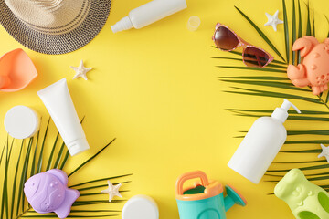 Child summer skincare idea. Top view flat lay of cosmetic bottles, sand molds for beach, sunhat,...