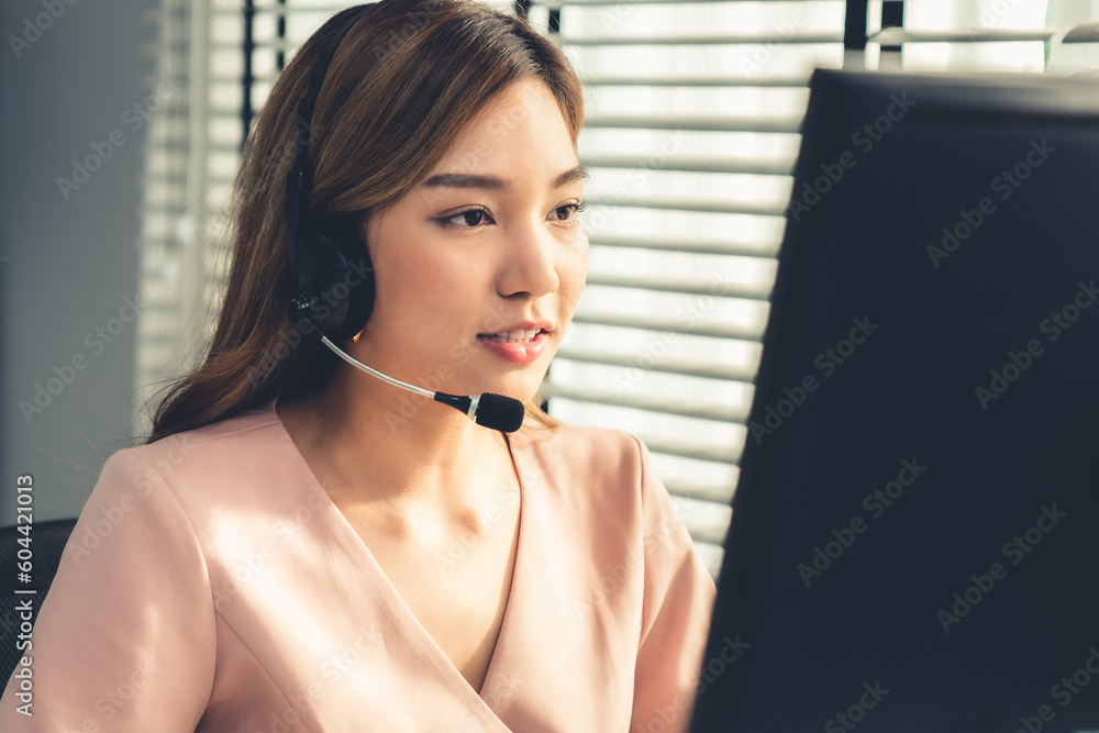 Aufkleber competent female operator working on computer and while talking with clients. concept relevant to bo