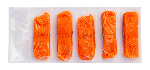 Pieces of frozen fish salmon in plastic packaging isolated on white background
