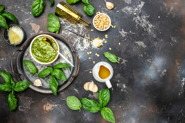 pesto with italian recipe ingredients, Basil, olive oil, parmesan, garlic, pine nuts. banner, menu, recipe place for text, top view