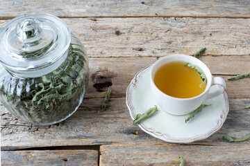 cup of green tea on wooden table